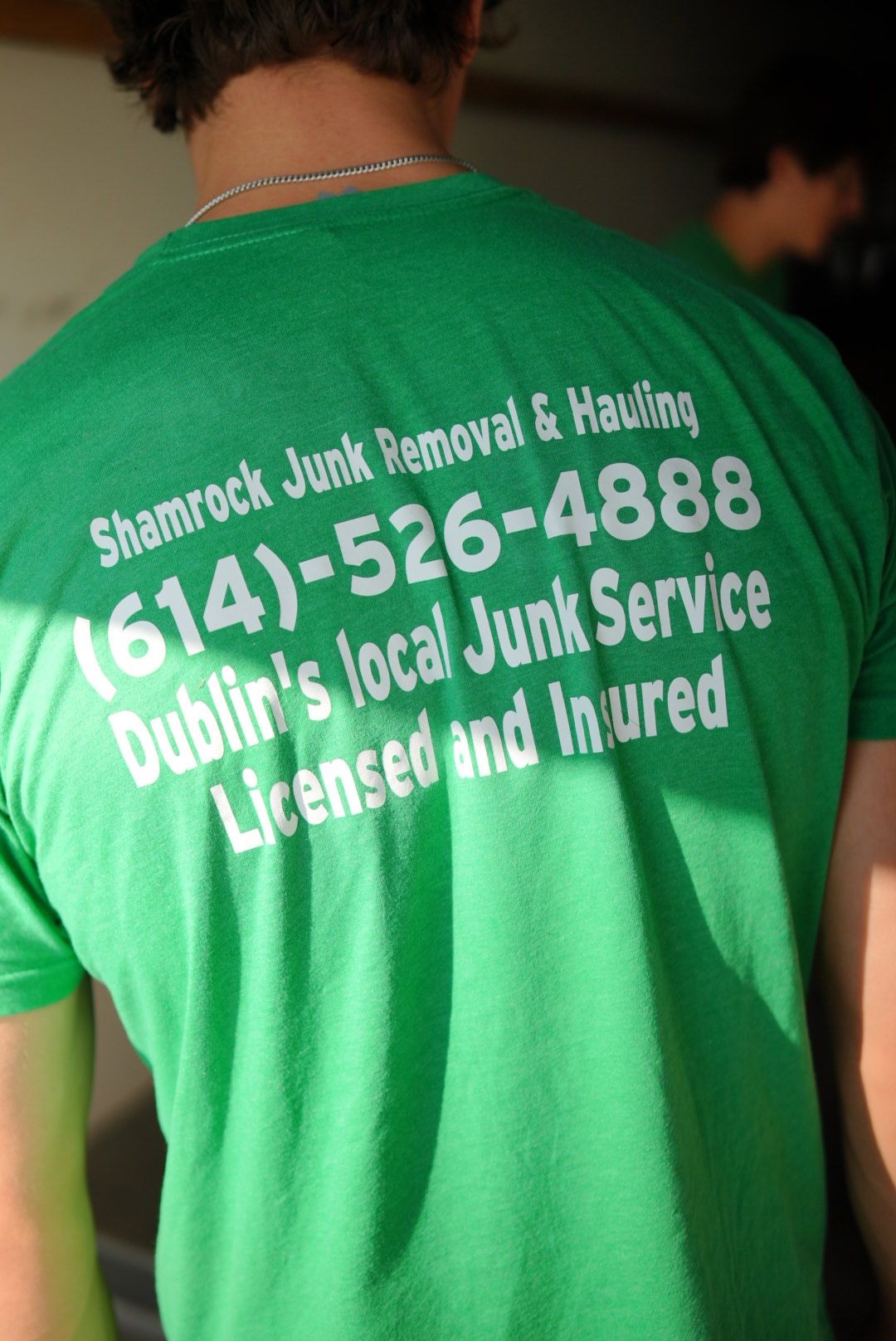 Shamrock Junk Removal back of shirts